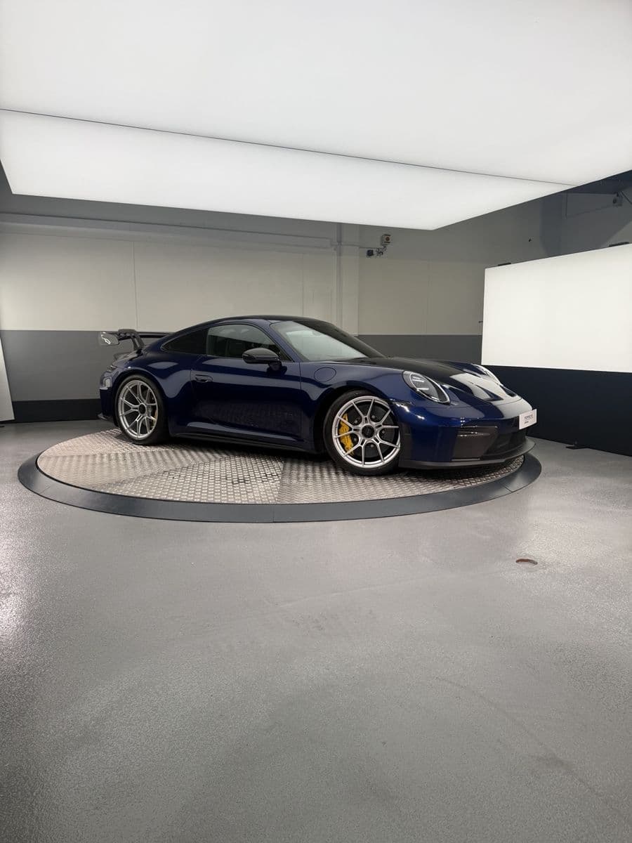 TAG's blue Porsche 911 GT3 on the detailing studio turntable